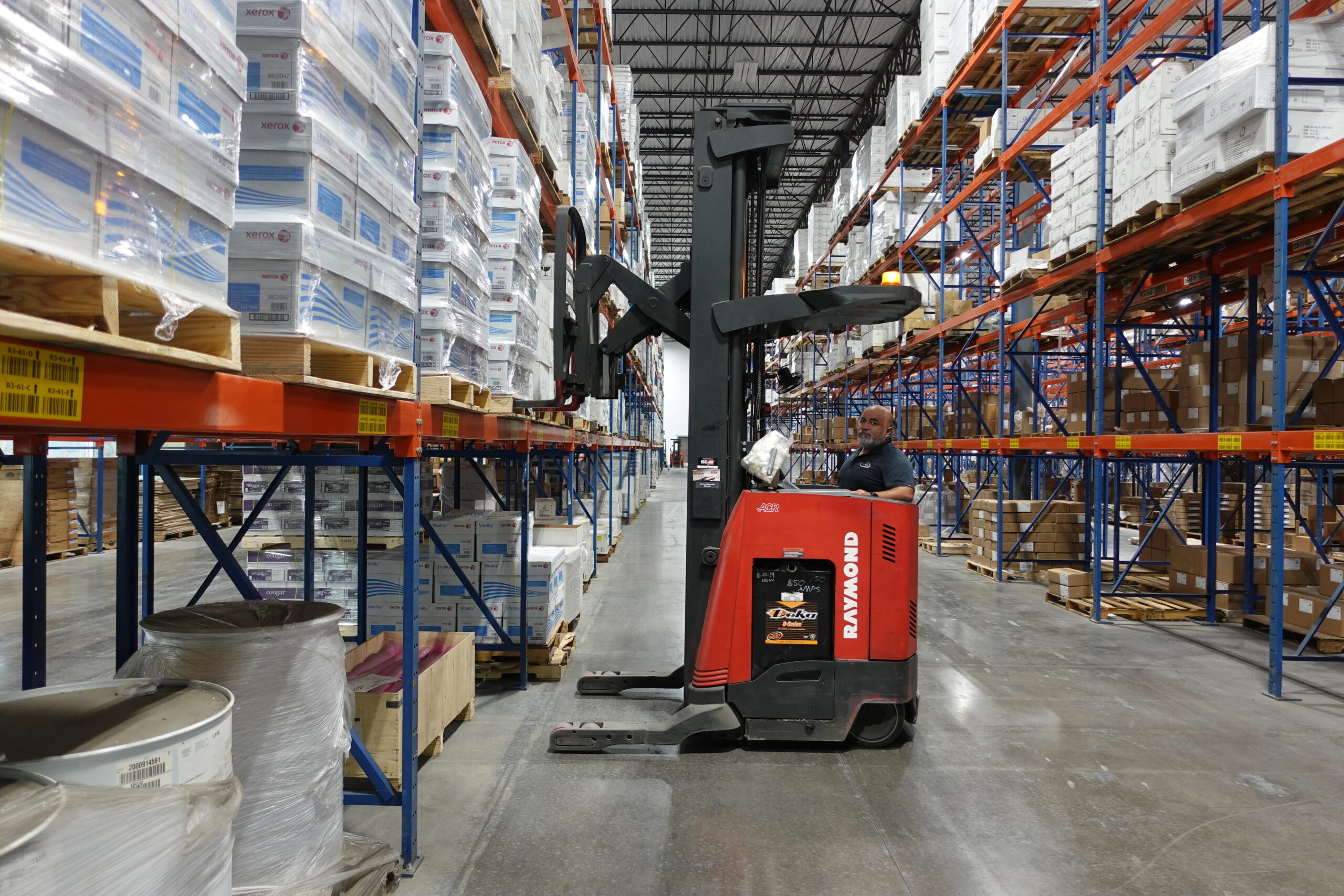 Worker managing logistics in fulfillment center